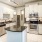 a kitchen with white cabinets
