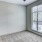 a room with a window and a carpet