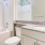 a bathroom with a marble countertop
